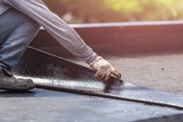 Professional Basement Waterproofing technician working in Carrollton, KY